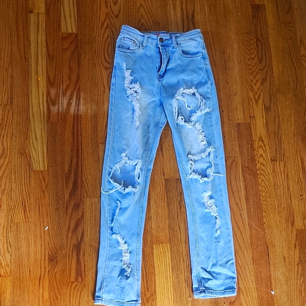 Pair of ripped denim jeans